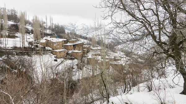 Hizan, a remote village in Eastern Turkey Anatolia with stone houses, snowy landscape. The frozen landscape capture the essence of winter in Hizan