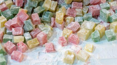 Turkish lokum, also known as Turkish delight, is a popular confectionery in Turkey. Lokum comes in a variety of colors and flavors clipart