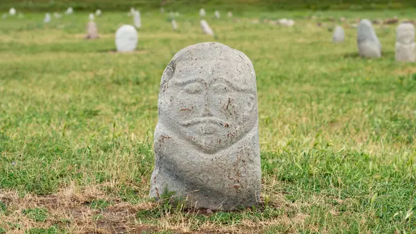 stock image Stone sculptures near the Old Burana Tower in Kyrgyzstan, depicting historical figures, reflecting the country's rich cultural heritage.