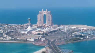 Abu Dhabi, United Arab Emirates - 14 Feb 2022: Aerial view of Marina Mall and Marina Village, showcasing the Rixos Marina Hotel by the coastline. Vibrant cityscape with serene waterfront. clipart