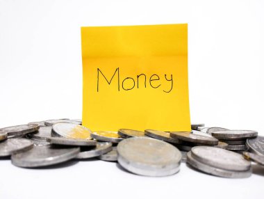 Picture of pile of silver coins and sticky note with word 