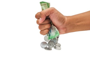 Picture of a hand and Indonesia money  clipart