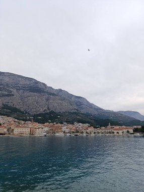 Panorama view of Dalmatian town Makarska and mountain Biokovo clipart