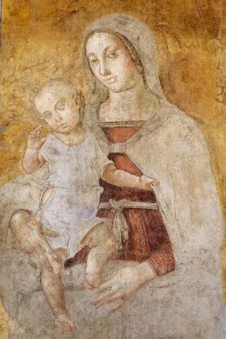 Napoli, İtalya - 10-28-2024: Bakire Meryem Fresco Bebek İsa 'yı kollarında tutuyor.