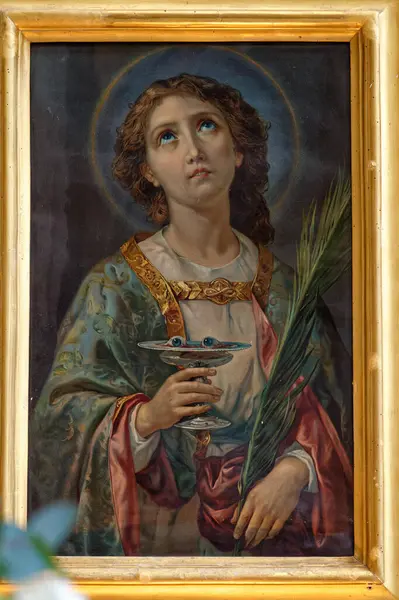Napoli, İtalya - 10-24-2024: Saint Lucy veya Sainte Lucie 'nin Tablosu. Roma Katolik Kilisesi 'nin azizi..