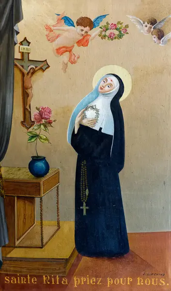 Saint Michel de Maurienne, FRANCE - 07-27-2024: Cascia 'lı Aziz Rita' nın ya da umutsuz vakaların patronu Sainte Rita de Cascia 'nın tablosu. Roma Katolik Kilisesi 'nin azizi.. 
