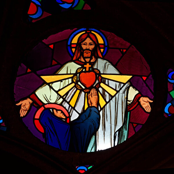 Paris, FRANCE - 08-03-2024: Stained glass of Vision of Sacred Heart of Jesus Christ to Saint Margaret Mary Alacoque or Sainte Marguerite Marie Alacoque.