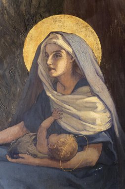 Paris, FRANCE - 09-14-2024: Bebek İsa 'yı kollarında tutan Bakire Meryem' in Tablosu.