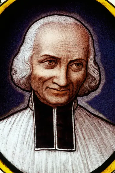 Annecy, FRANCE - 07-03-2024: St. Francis de Sales 'in lekeli camları ve bir güvercin. Katolik Kilisesi 'nin Aziz ve Doktoru