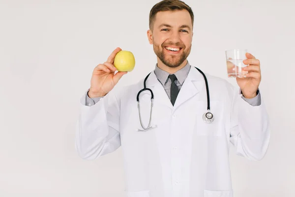Happy Male Nutritionist Doctor Stethoscope Smiling Holding Water Apple White — Stock Photo, Image