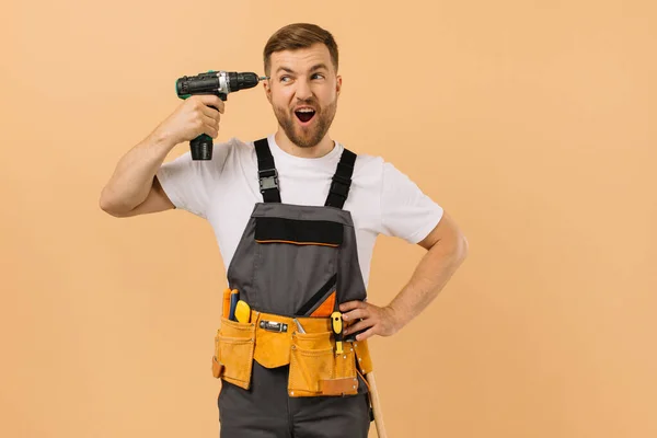 Positive Male Repairman Home Screwdriver Sticking His Head Shouting Beige — Stock Photo, Image