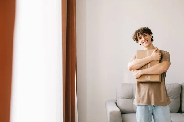 Shopping Delivery Curly Young Man Customer Holding Cardboard Box Posing — Stock Photo, Image