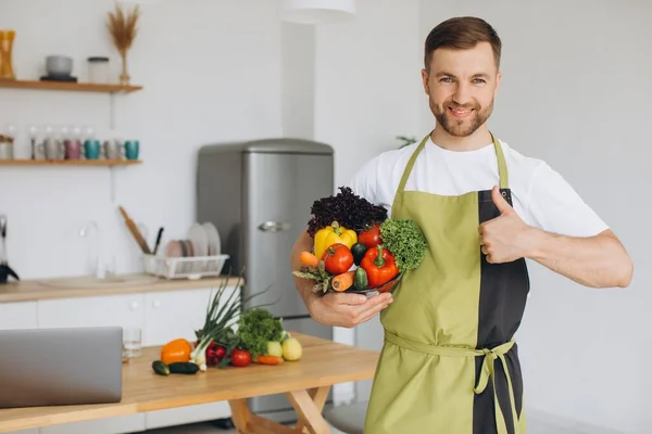 Portrait Happy Man Holding Plate Fresh Vegetables Background Kitchen Home — Stock Photo, Image