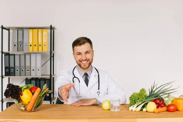 Happy Doctor Nutritionist Sitting Workplace Desk Office Fresh Vegetables Shaking — Stock Photo, Image