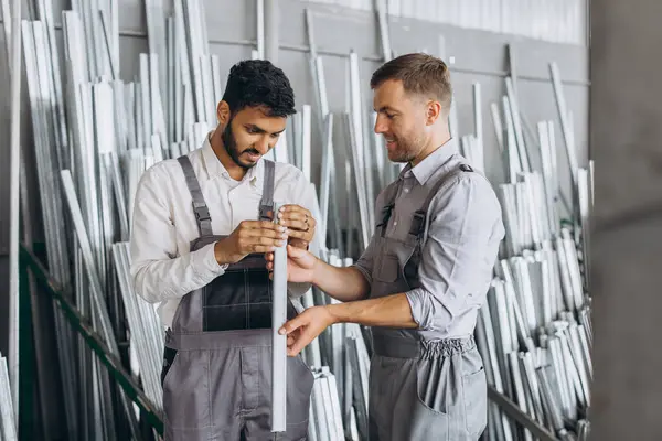 Two International Male Workers Uniform Discuss Work Process Metal Plastic — Stock Photo, Image
