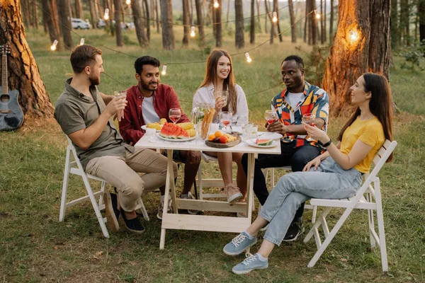 Multiracial Group Happy Friends Sitting Table Drinking Wine Talking Dinner — Stock Photo, Image