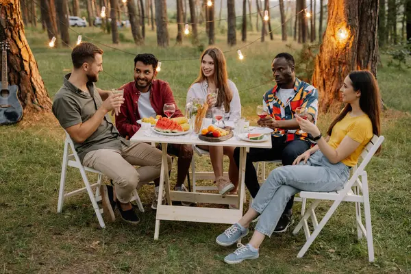 Multiracial Group Happy Friends Sitting Table Drinking Wine Talking Dinner — Stock Photo, Image