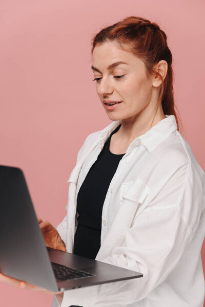 Mature woman with braces having a consultation with orthodontist on video call
