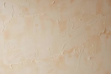 Soyut çiziklerle bej desenli duvar arkaplanı