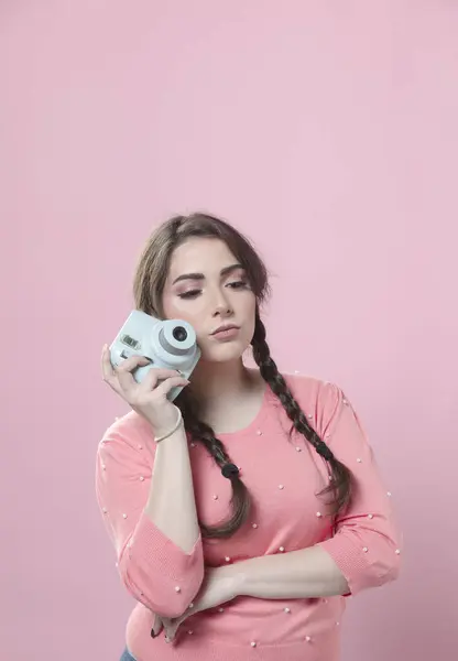 stock image Woman posing with camera next to face and copy space