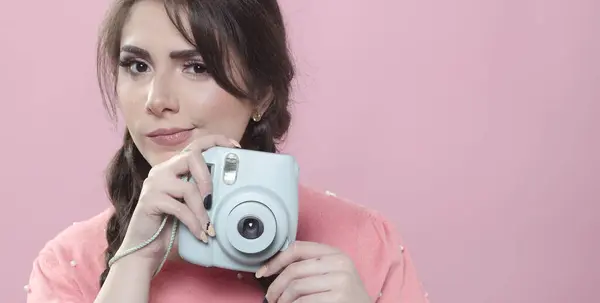 stock image Front view of woman holding camera with copy space