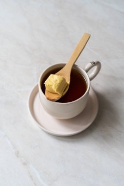 Bulletproof coffee, blended with organic butter and MCT coconut oil, paleo, keto, ketogenic drink breakfast. ready to serve.