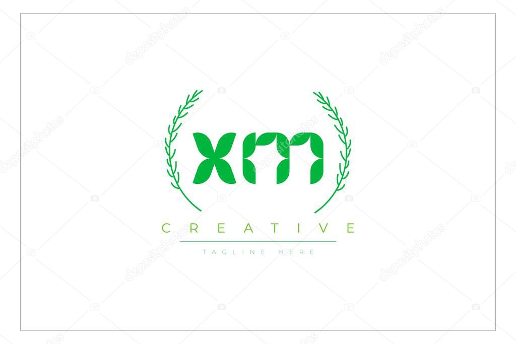 XM Green Minimalist Logo Design Featuring Natural Leaves and Text Elements. Fresh nature and healthy leaf logo design.