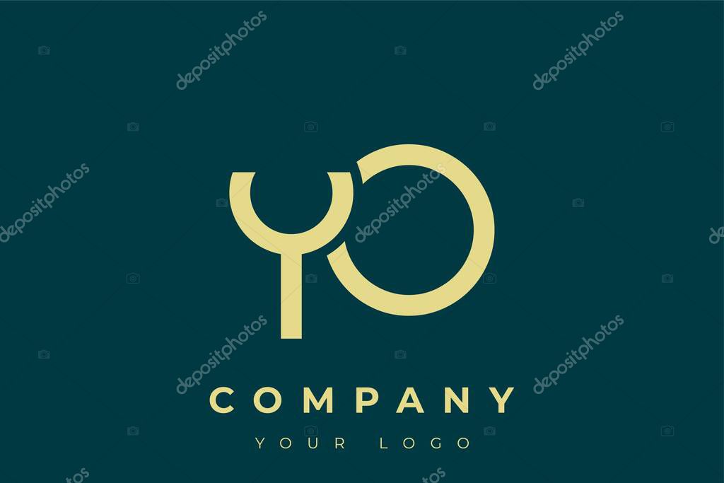 YO Modern Golden Logo. This modern and elegant logo features a sleek monogram design combining the letters A and B in a stylized, minimalist form. Rendered in a luxurious gold color against a deep teal background.