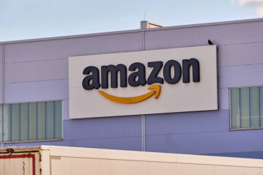 Winsen, Germany ; September 30, 2025: Close up of Amazon company logo on distribution center facade, representing e-commerce, retail business and logistics hub in the Hamburg area.
