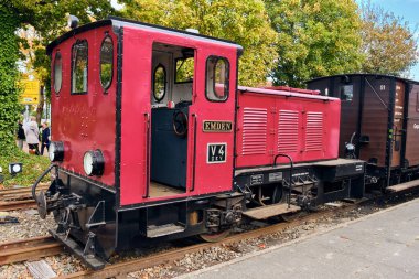 Bruchhausen-Vilsen, Germany ; October 3, 2025: Henschel diesel locomotive Emden V4 prepares a heritage train with baggage and passenger cars during the museum railway open day.