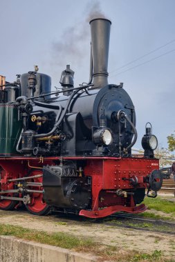 Bruchhausen-Vilsen, Germany; October 3, 2025: Colorful Sunrail diesel locomotive offers short rides for children during the Turen auf mit der Maus open day at the railway museum.