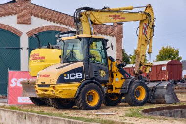 Bruchhausen-Vilsen, Germany; October 3, 2025: Colorful Sunrail diesel locomotive offers short rides for children during the Turen auf mit der Maus open day at the railway museum.