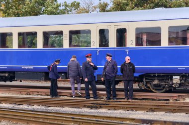 Bruchhausen-Vilsen, Germany ; October 3, 2025: Historic railcar with conductors and volunteers during Deutscher Eisenbahn-Verein open day, celebrating railway heritage and tradition.