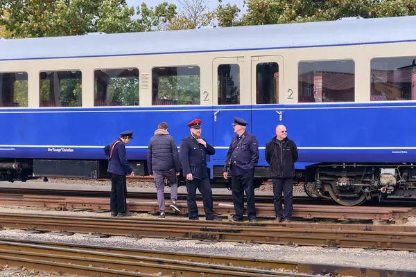 Bruchhausen-Vilsen, Germany ; October 3, 2025: Historic railcar with conductors and volunteers during Deutscher Eisenbahn-Verein open day, celebrating railway heritage and tradition.