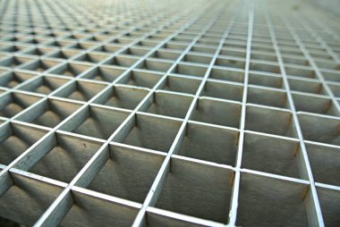 Close-up view of a metal grid structure highlighting its geometric pattern suitable for construction and industrial applications. clipart