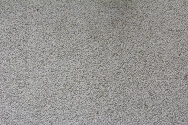 Tek desenli, açık kahverengi ya da bej duvar yüzeyinin ince tanecikli desenli yakın plan görüntüsü.