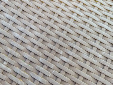 Karmaşık sepet dokuma deseni ve doğal lif yapısını gösteren dokunmuş hasır kumaşın detaylı dokusu. Yüksek kalite fotoğraf