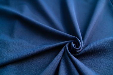 Arkaplan için merkezden uzak sarmal mavi renkli kumaş