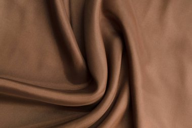 Arkaplan için kahverengi renkli katlanmış kumaş dokusu kapatma ayrıntısı 