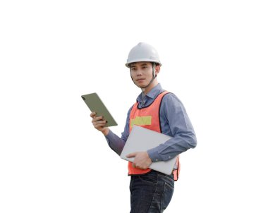 A man wearing a safety vest and a hard hat is holding a tablet and a laptop. He is a construction worker or a worker in a hazardous environment clipart