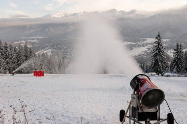 Snow Cannons in Operation at Ski Resort in Zakopane, Poland clipart