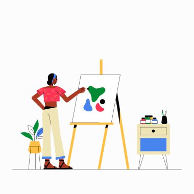 Bir stüdyoda sehpada duran ve soyut sanat eserleri yapan kadın sanatçı, yaratıcılığı, sanatsal ifadeyi ve beyaz bir arka planda izole edilmiş bir sanatçının çalışmasını sembolize ediyor..