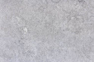 Cilalanmamış taş yüzeyin yapısal arka planı. Parlatılmamış taş dokusunun doğal soyut kalıbına sahip boş arkaplan.