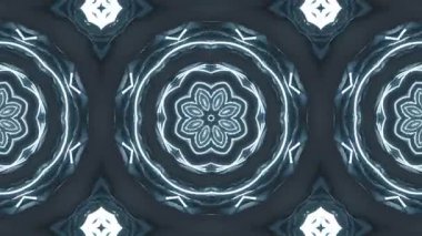 Karanlık bir arkaplanda parlayan beyaz çizgilerle simetrik geometrik desenler içeren animasyon videolar. Şekiller şekil değiştirir..