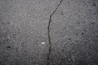 Çatlak asfalt dokusu arka planı, üst görünüm asfalt dokusu arka planı