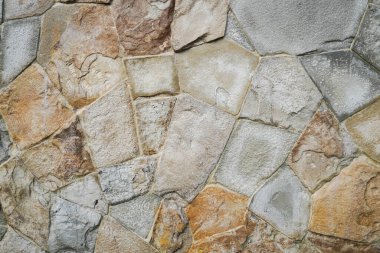 Doğal granit duvar. Kaba doğal taş. Krem rengi tuğla kaplama duvar dokusu arkaplanı.