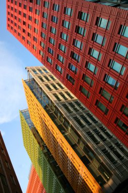 Nadir shot of corporate buildings in red, yellow, green and orange of some street in London clipart