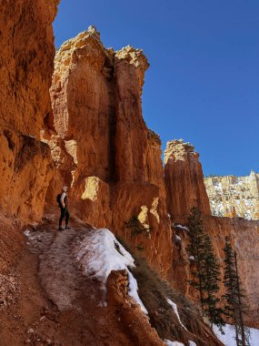 Bryce Canyon, Hiker male in Bryce Canyon, man with Canyon in Background, Nature, Landscape, Mountains, Amazing View, Tourism in Utah, USA, Hiking, Red Rocks, Hike, Sunny Day, hiking tourism clipart