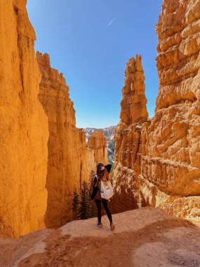 Bryce Canyon, Hiker in Bryce Canyon, woman with Canyon in Background, Nature, Landscape, Mountains, Amazing View, Tourism in Utah, USA, Hiking, Red Rocks, Hike, Sunny Day, hiking tourism clipart