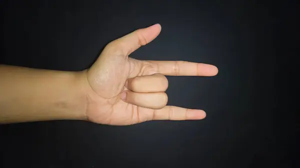 Kaya el işareti izole edilmiş siyah arkaplan